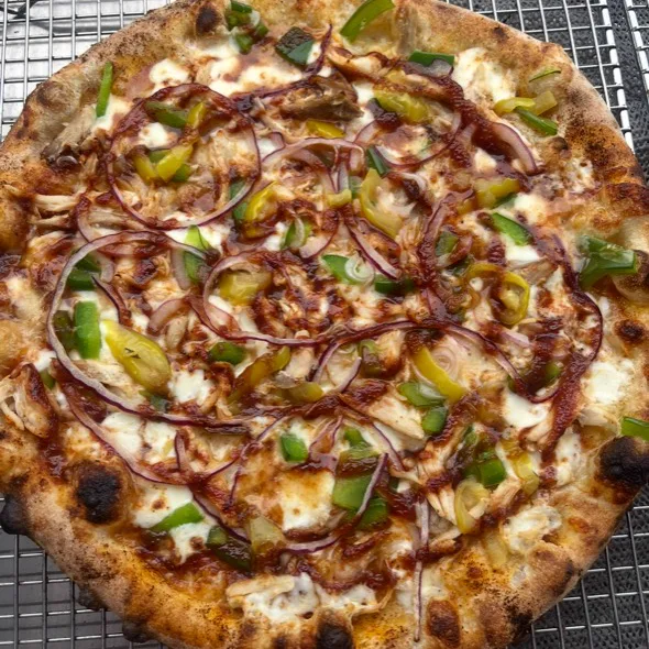 PieZ specialty pizza with chicken, peppers, red onion, and barbecue sauce